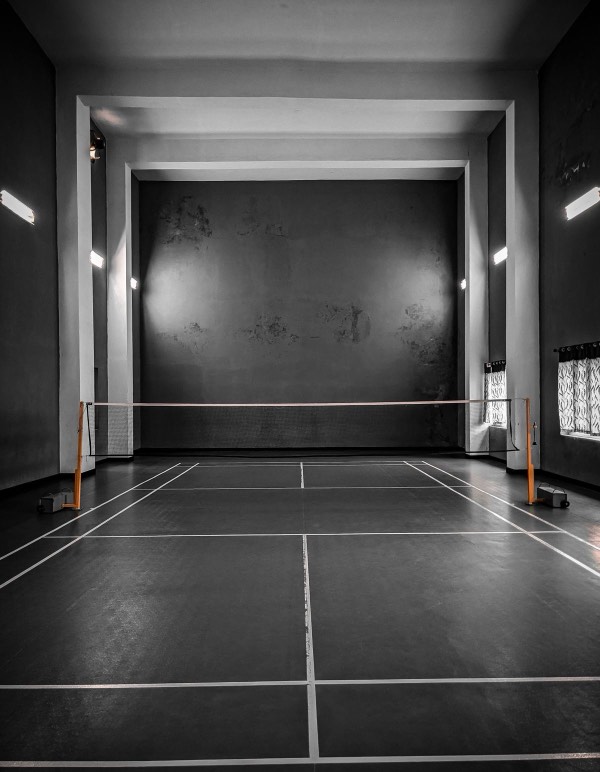 Empty indoor sports court showing court flooring and line markings