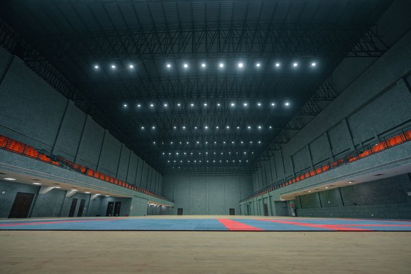 Bright, empty indoor sports hall ready for multi-sport use